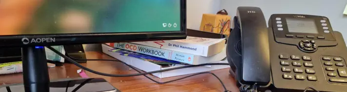 computer desk with phone and computer