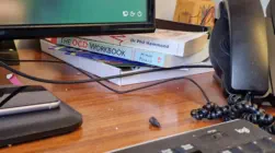 Office desk with computer and phone